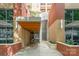 A modern brick building entrance with water feature and stylish architectural details at 701 Royal Ct # 102, Charlotte, NC 28202