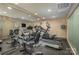 Well-equipped fitness center with cardio machines and mirrored walls for your workout needs at 701 Royal Ct # 102, Charlotte, NC 28202