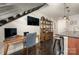 Kitchen with granite counters, island with seating and dark wood floors in an open floor plan at 701 Royal Ct # 102, Charlotte, NC 28202
