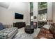 Bright living room with high ceilings, large windows, stylish furnishings, and hardwood flooring at 701 Royal Ct # 102, Charlotte, NC 28202