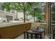 Cozy covered patio featuring outdoor seating and views of the city street at 701 Royal Ct # 102, Charlotte, NC 28202