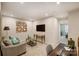 A Comfortable loft area featuring neutral decor, a sofa, and a workstation, ideal for relaxing or working at 8009 Downy Oak Ln, Charlotte, NC 28269