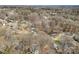 Picturesque aerial shot of homes interspersed within a heavily wooded landscape, showcasing neighborhood tranquility at 8123 Chrisbry Ln, Charlotte, NC 28215