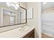 A well-lit bathroom featuring neutral wall color and a large mirror at 8123 Chrisbry Ln, Charlotte, NC 28215