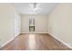 This spacious bedroom boasts wood floors and a bright window at 8123 Chrisbry Ln, Charlotte, NC 28215