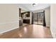 Open concept dining room featuring laminate wood floors and sliding glass doors to the outside deck at 8123 Chrisbry Ln, Charlotte, NC 28215