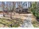 Charming home with a driveway, brick facade, and mature trees at 8123 Chrisbry Ln, Charlotte, NC 28215
