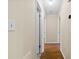 A hallway with wood flooring that leads to several rooms at 8123 Chrisbry Ln, Charlotte, NC 28215
