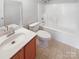 Bathroom featuring single sink vanity and shower-tub combo at 8813 Gerren Ct, Charlotte, NC 28217