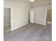 Bedroom featuring neutral carpeting, a ceiling fan, and ensuite bathroom at 8813 Gerren Ct, Charlotte, NC 28217