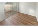 Bedroom featuring hardwood floors and sliding glass door at 8813 Gerren Ct, Charlotte, NC 28217