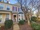 Attractive townhome with brick and siding, an inviting entrance, and landscaped front at 8813 Gerren Ct, Charlotte, NC 28217