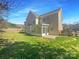 Spacious backyard features a lush lawn, privacy fence, and enclosed sunroom on the house at 1000 High Brook Dr, Waxhaw, NC 28173