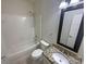 Bathroom featuring a shower-tub combo, a toilet, and a granite countertop vanity at 1000 High Brook Dr, Waxhaw, NC 28173