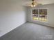 Bedroom featuring neutral carpet, a ceiling fan, and a window with neighborhood views at 1000 High Brook Dr, Waxhaw, NC 28173