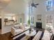 Bright, staged living room with high ceilings, fireplace, and an open view to the adjacent kitchen area at 1000 High Brook Dr, Waxhaw, NC 28173