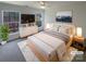 Serene primary bedroom with stylish decor, including a modern bed, dresser, and a cozy rug at 1000 High Brook Dr, Waxhaw, NC 28173