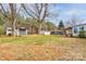 Expansive backyard with sheds and covered areas, offering ample storage and space at 107 Destiny Ln, Shelby, NC 28150