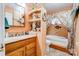 Bathroom with a tub, a sink, a stained glass window, and wood look flooring at 107 Destiny Ln, Shelby, NC 28150
