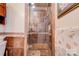 Bathroom featuring a tiled walk-in shower with glass door and a hand-held shower head at 107 Destiny Ln, Shelby, NC 28150