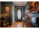 Warm and inviting entryway with hardwood floors and elegant décor, including a vintage chest at 107 Destiny Ln, Shelby, NC 28150