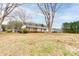 Spacious property featuring a brick home with mature trees and a large yard at 107 Destiny Ln, Shelby, NC 28150