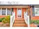 Inviting entryway with a brick facade, white railing, and decorative front door at 107 Destiny Ln, Shelby, NC 28150