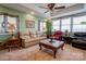 Bright living room offering neutral carpet, lots of large windows, and multiple seating areas at 107 Destiny Ln, Shelby, NC 28150