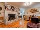 Living room featuring a brick fireplace with a white mantel and hardwood floors at 107 Destiny Ln, Shelby, NC 28150