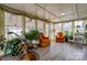 Bright sunroom with hardwood floors, large windows, and comfortable armchairs at 107 Destiny Ln, Shelby, NC 28150