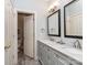 Elegant bathroom features a double vanity, granite countertops, and a separate toilet room at 1141 Hollyheath Ln, Charlotte, NC 28209