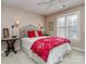 Inviting bedroom featuring a comfortable bed with accent pillows, side tables and bright natural light at 1141 Hollyheath Ln, Charlotte, NC 28209