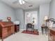 Charming bedroom with ample natural light, complemented by stylish decor, vintage furnishings and neutral walls at 1141 Hollyheath Ln, Charlotte, NC 28209