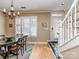 Inviting dining area with hardwood floors and natural light, adjacent to the home's staircase and entrance at 1141 Hollyheath Ln, Charlotte, NC 28209