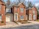 Charming red brick townhome with a well-maintained front yard and inviting entrance at 1141 Hollyheath Ln, Charlotte, NC 28209