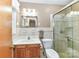 Bright bathroom featuring a glass shower door and ample vanity space at 117 Gwyn St, Wingate, NC 28174