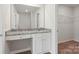 Bathroom vanity with a granite countertop, drawers, and a view to the closet at 117 Lightning Dr, Shelby, NC 28152