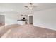 Spacious living room featuring a ceiling fan and a seamless transition to the kitchen area at 117 Lightning Dr, Shelby, NC 28152