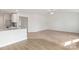 Bright living room with carpeted floors, open floor plan to kitchen with granite countertops and stainless appliances at 123 Lightning Dr, Shelby, NC 28152