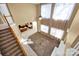 Spacious Living Room with high ceiling, carpet flooring, a ceiling fan, and large bright windows at 14333 Maclauren Ln, Huntersville, NC 28078