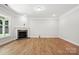 Basement with a stone fireplace, hardwood flooring, and natural lighting at 149 Prestwick Way # 39, Mooresville, NC 28115