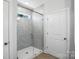 Stylish bathroom featuring a glass shower with tiled walls and a neutral color scheme at 149 Prestwick Way # 39, Mooresville, NC 28115