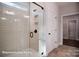 Modern shower boasts a glass enclosure, white subway tile, and modern fixtures and natural light at 149 Prestwick Way # 39, Mooresville, NC 28115