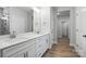 Bright bathroom featuring double vanity, framed mirrors, and shower with a glass door at 149 Prestwick Way # 39, Mooresville, NC 28115