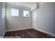 Bedroom features hardwood floors, white trim, and two windows providing plenty of light at 149 Prestwick Way # 39, Mooresville, NC 28115