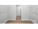 Walk-in closet with built-in wire shelving, ample storage space and wood-look flooring at 149 Prestwick Way # 39, Mooresville, NC 28115