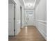 Bright foyer with hardwood floors, elegant trim, and a glimpse of the outdoors at 149 Prestwick Way # 39, Mooresville, NC 28115