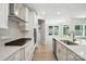 Well-equipped kitchen featuring quartz countertops, stainless steel appliances, and gas cooktop at 149 Prestwick Way # 39, Mooresville, NC 28115