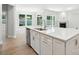 Open-concept kitchen island with stainless steel dishwasher and a view of the living area at 149 Prestwick Way # 39, Mooresville, NC 28115