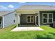 Covered patio area on a new construction home featuring an exterior entrance and an exterior air conditioning unit at 149 Prestwick Way # 39, Mooresville, NC 28115